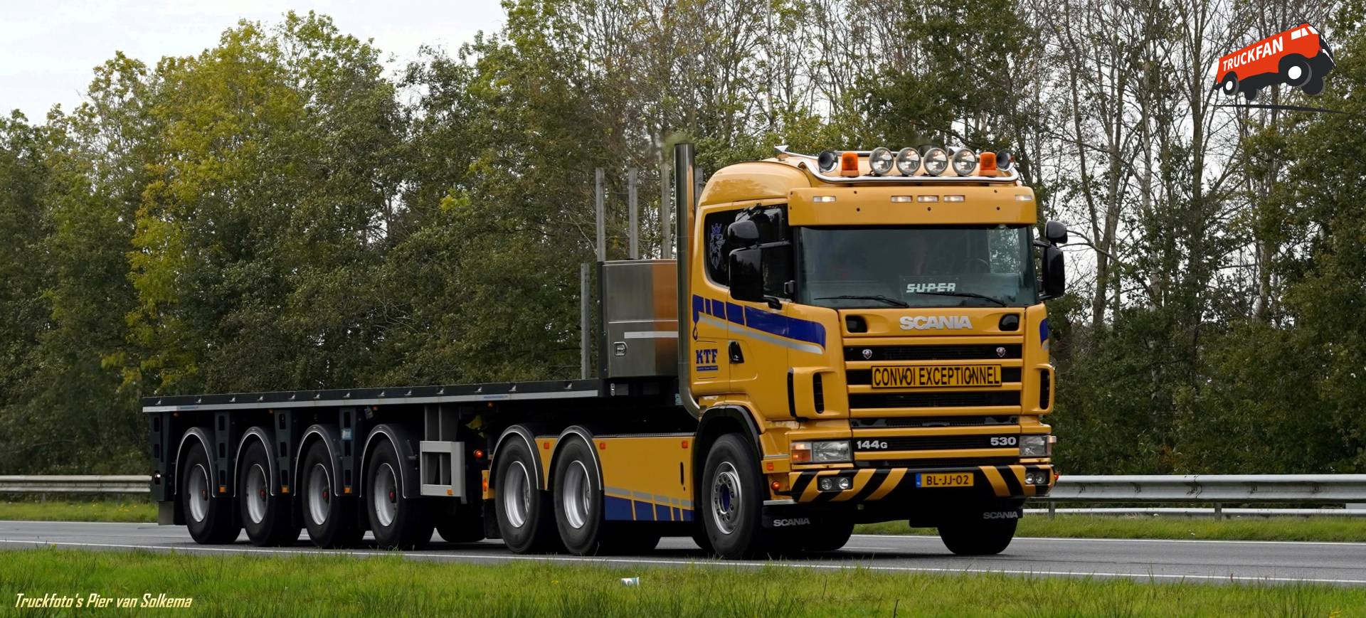 Scania 144G truck with an open cargo bed