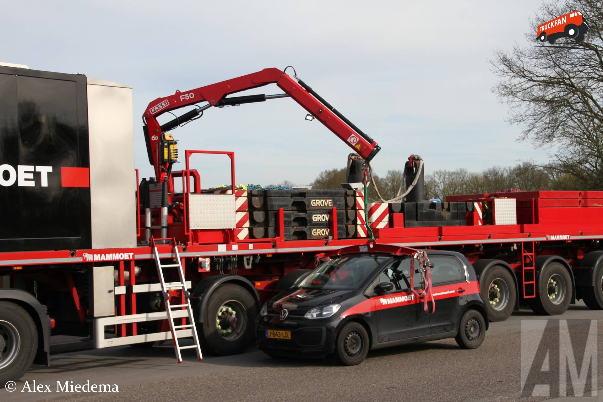 Fassi crane and Nooteboom ballast trailer near the A6