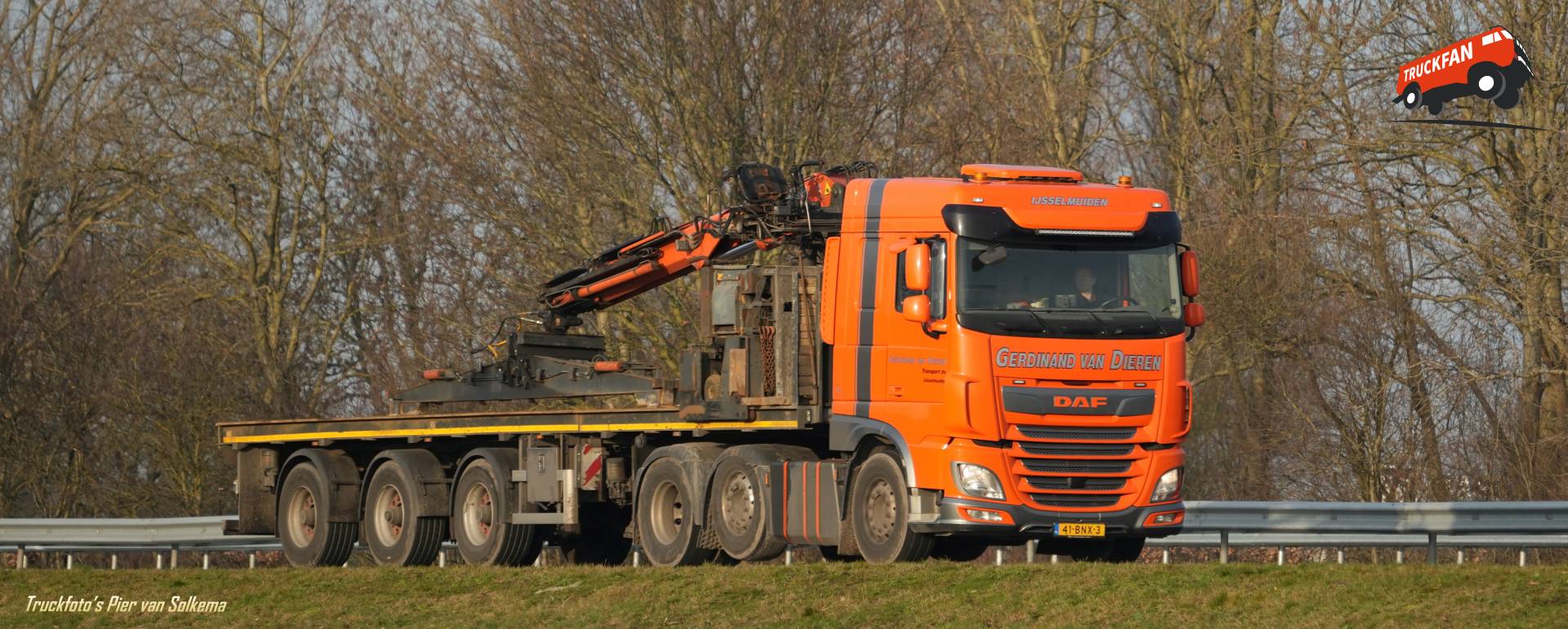 DAF XF truck with an open cargo bed on the A7 near Sneek