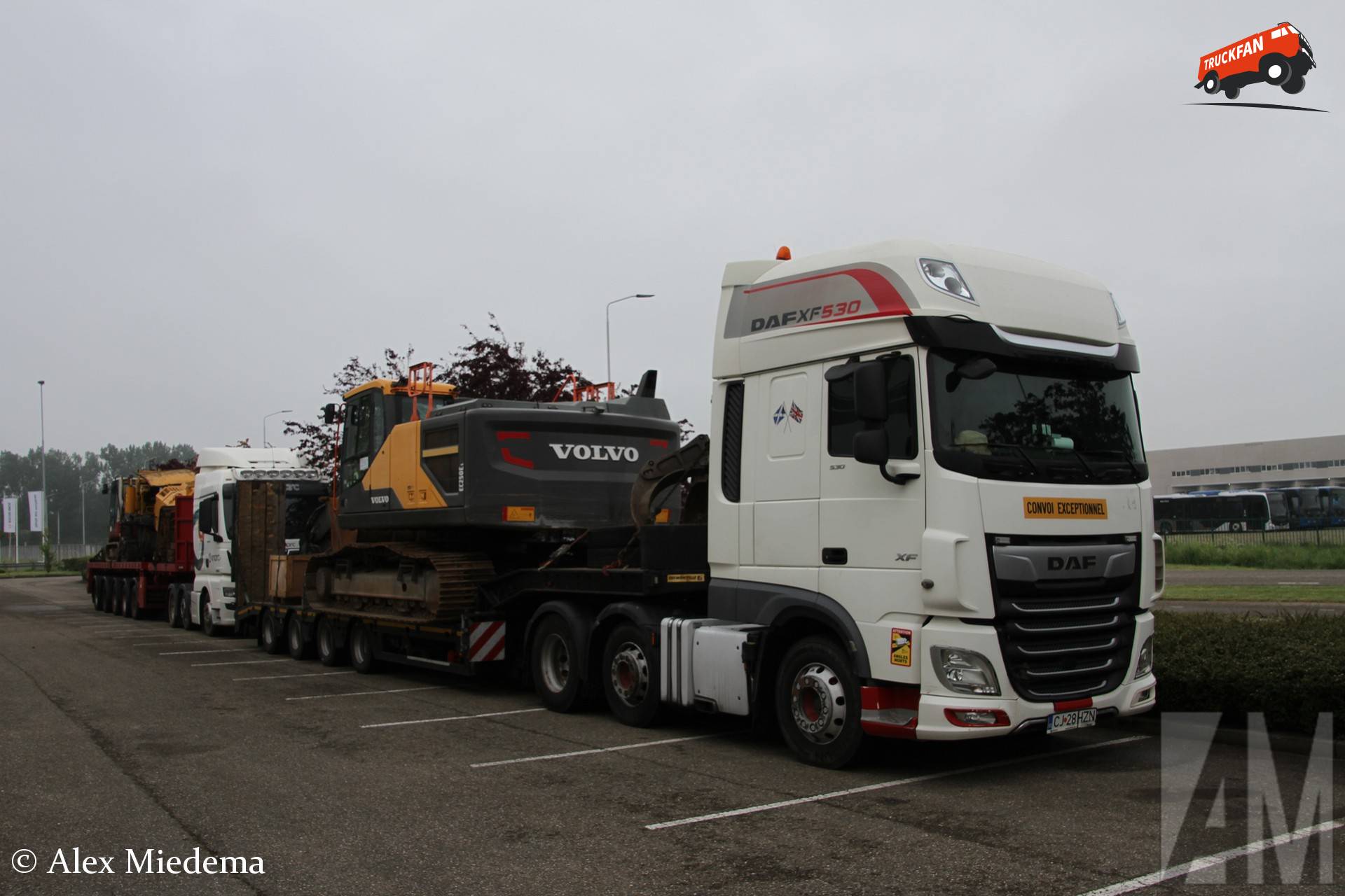 Volvo EC250E excavator delivered by DAF XF Euro 6 truck